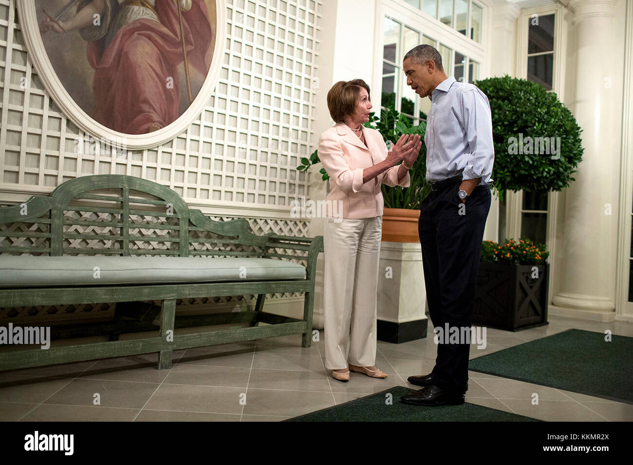 President Barack Obama speaks with House Minority Leader Nancy Pelosi, D-Calif. in the West Garden Room following the Congressional Picnic on the South Lawn of the White House, Sept. 17, 2014. Stock Photo