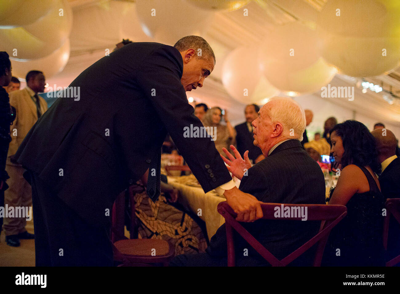 President Barack Obama talks with former President Jimmy Carter during the U.S.-Africa Leaders Summit dinner on the South Lawn of the White House, Aug. 5, 2014. Stock Photo