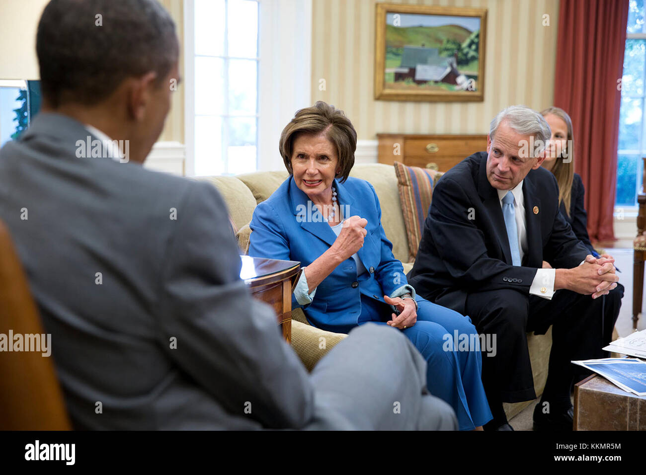 President Barack Obama meets with House Minority Leader Nancy Pelosi, D-Calif. and Democratic Congressional Campaign Committee Chairman Rep. Steve Israel, D-N.Y. in the Oval Office, July 31, 2014. Kelly Ward, Executive Director of the DCCC, seated at right. Stock Photo