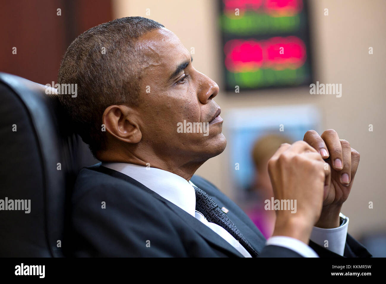 President Barack Obama convenes a National Security Council meeting in the Situation Room of the White House, July 28, 2014. Stock Photo