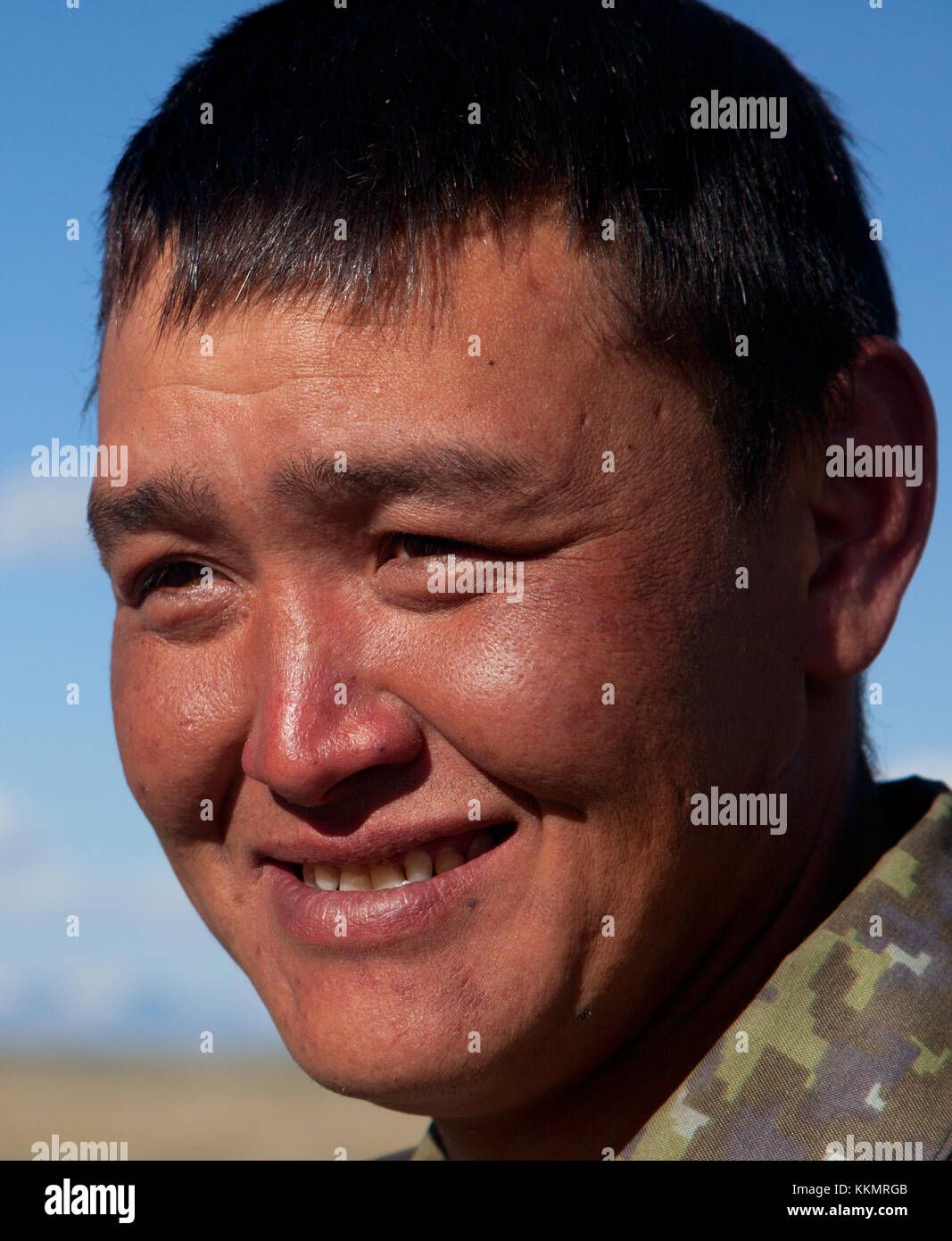 A young man of Asian appearance outdoors Stock Photo