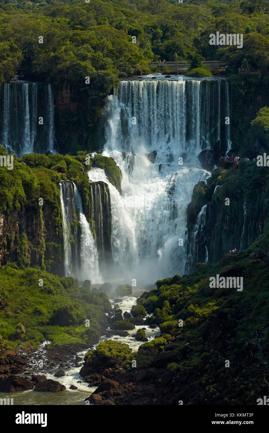 Tourists on walkway above Iguazu Falls, Argentina, seen from Brazil side, South America Stock Photo