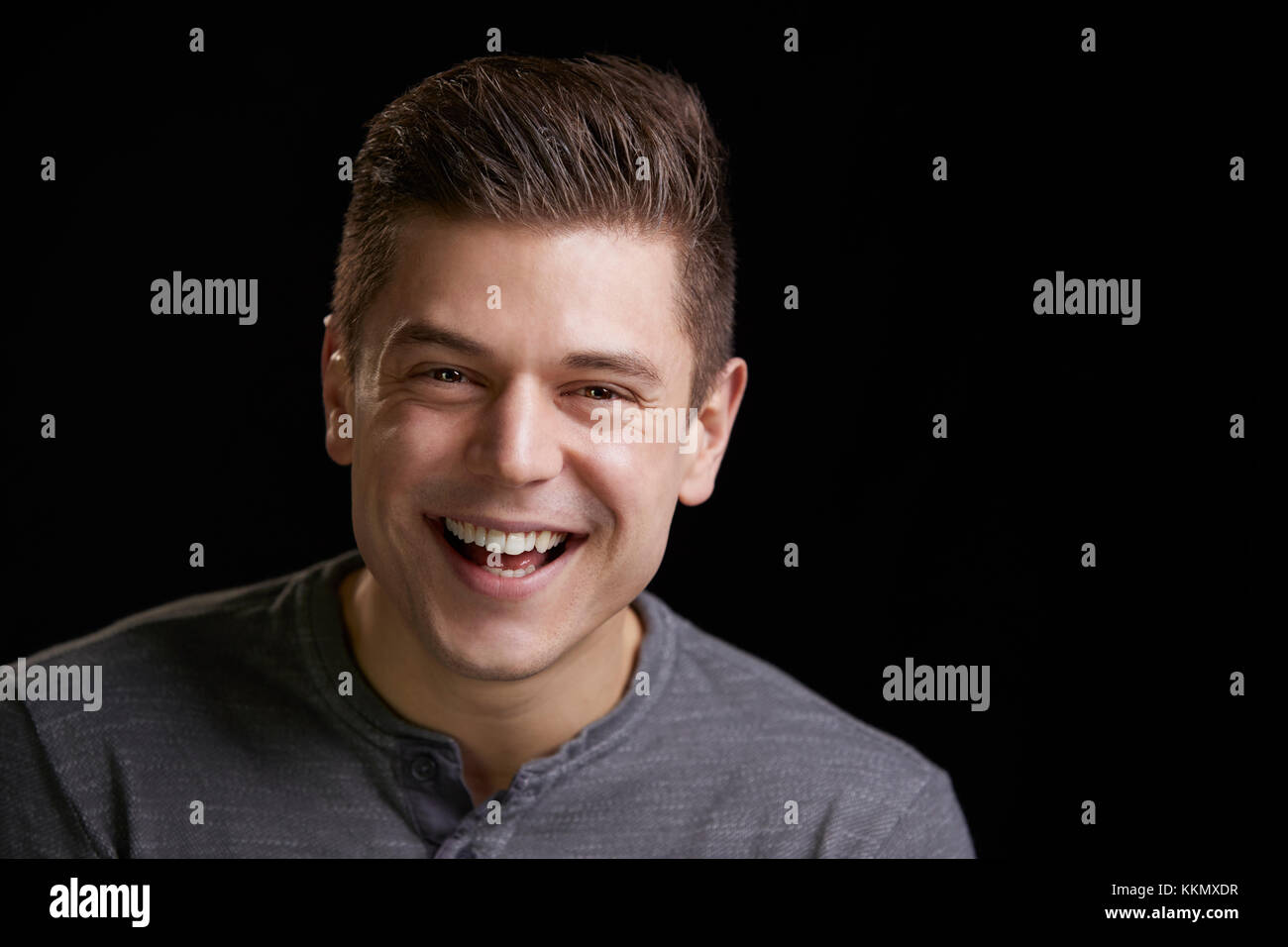 Portrait of a smiling young white man looking to camera Stock Photo