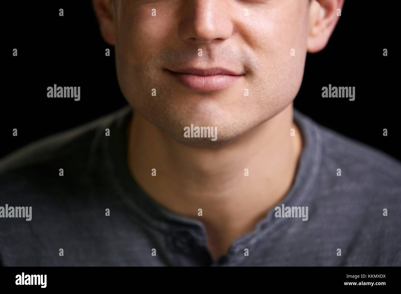 Cropped portrait of a smiling young white man Stock Photo