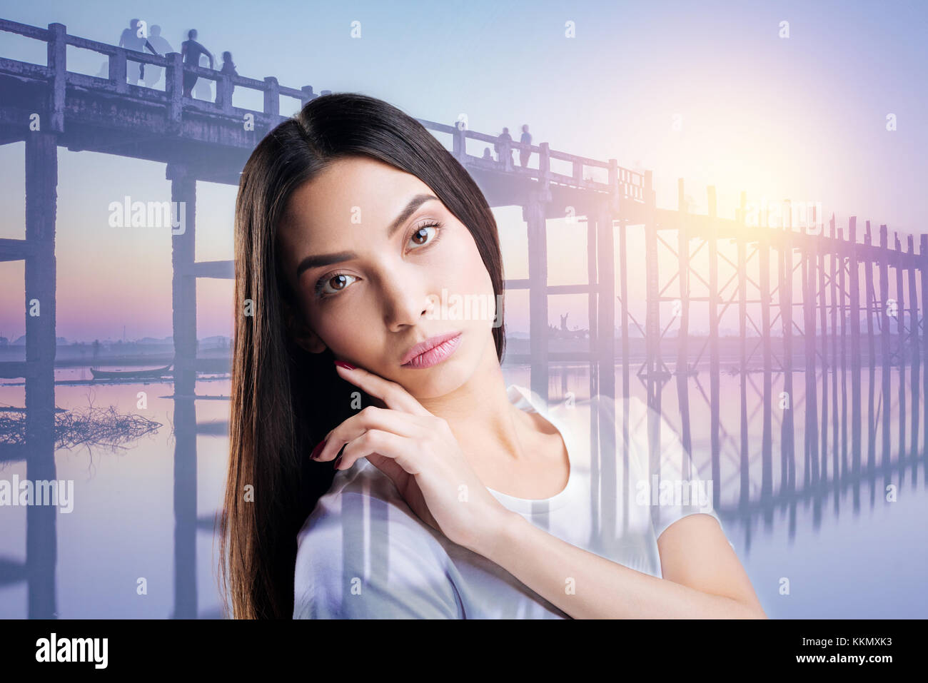 Pretty girl touching her chin Stock Photo Alamy