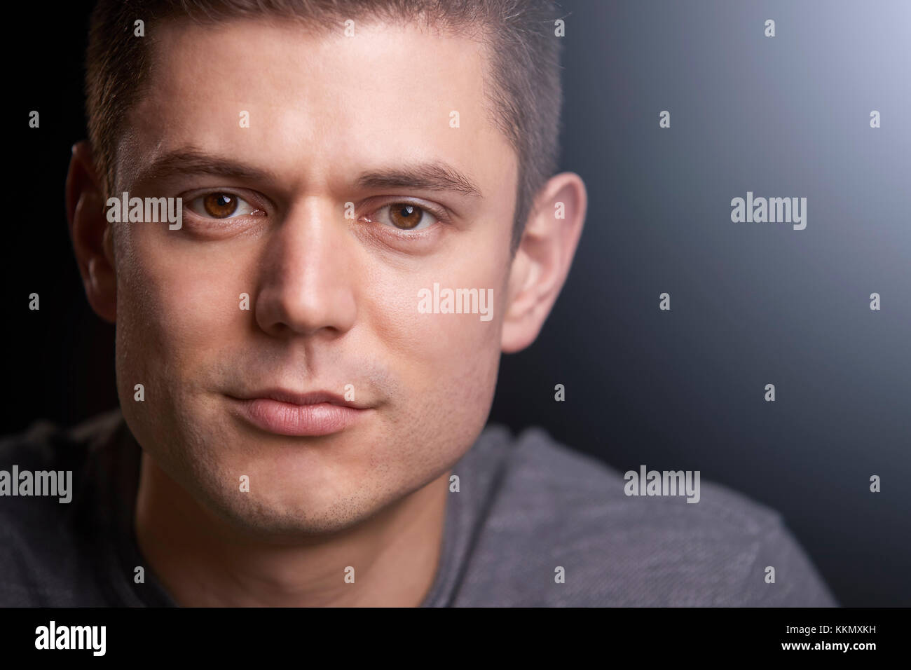 Close up portrait of a young white man looking to camera Stock Photo