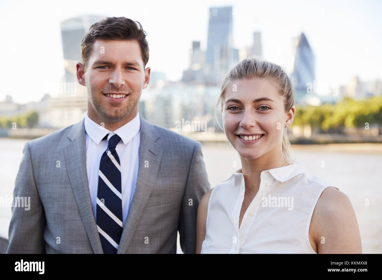 Portrait Of Businesspeople Standing By River Thames In London Stock Photo