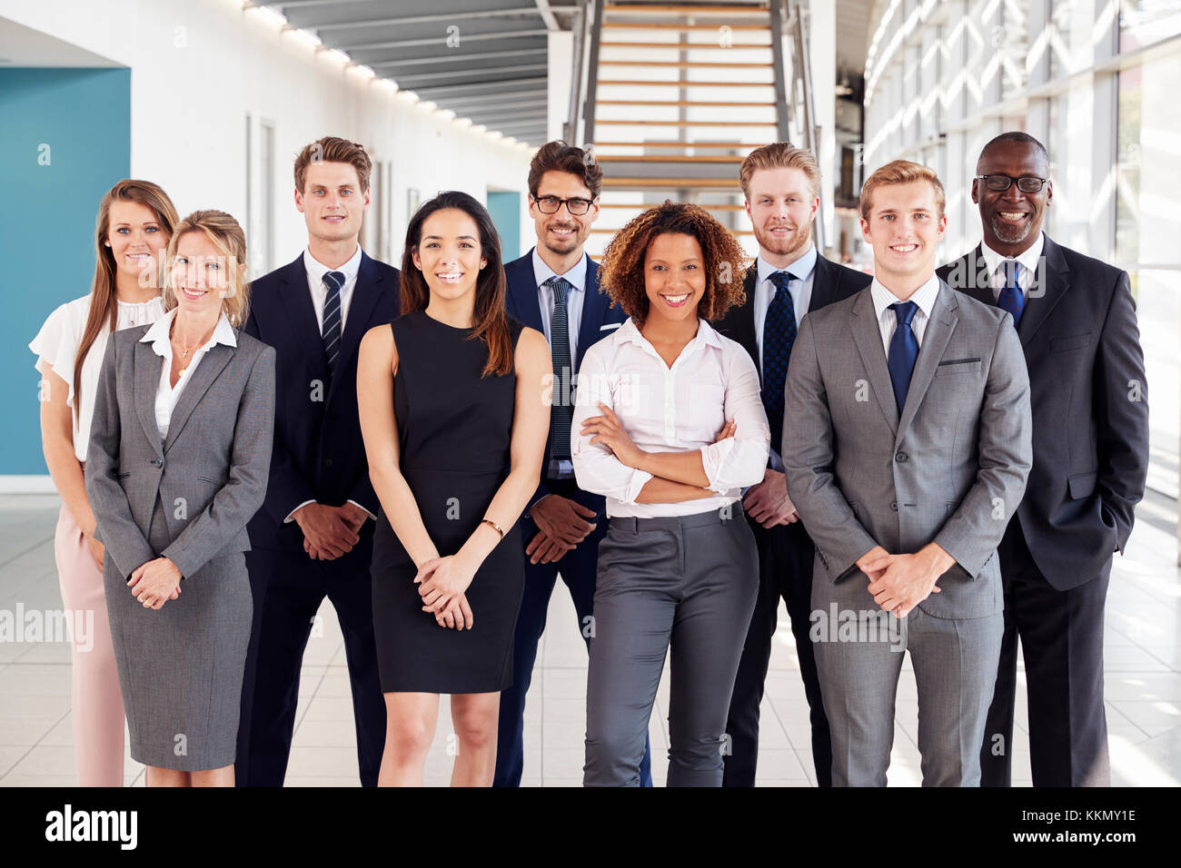 Office workers in a modern lobby, group portrait Stock Photo