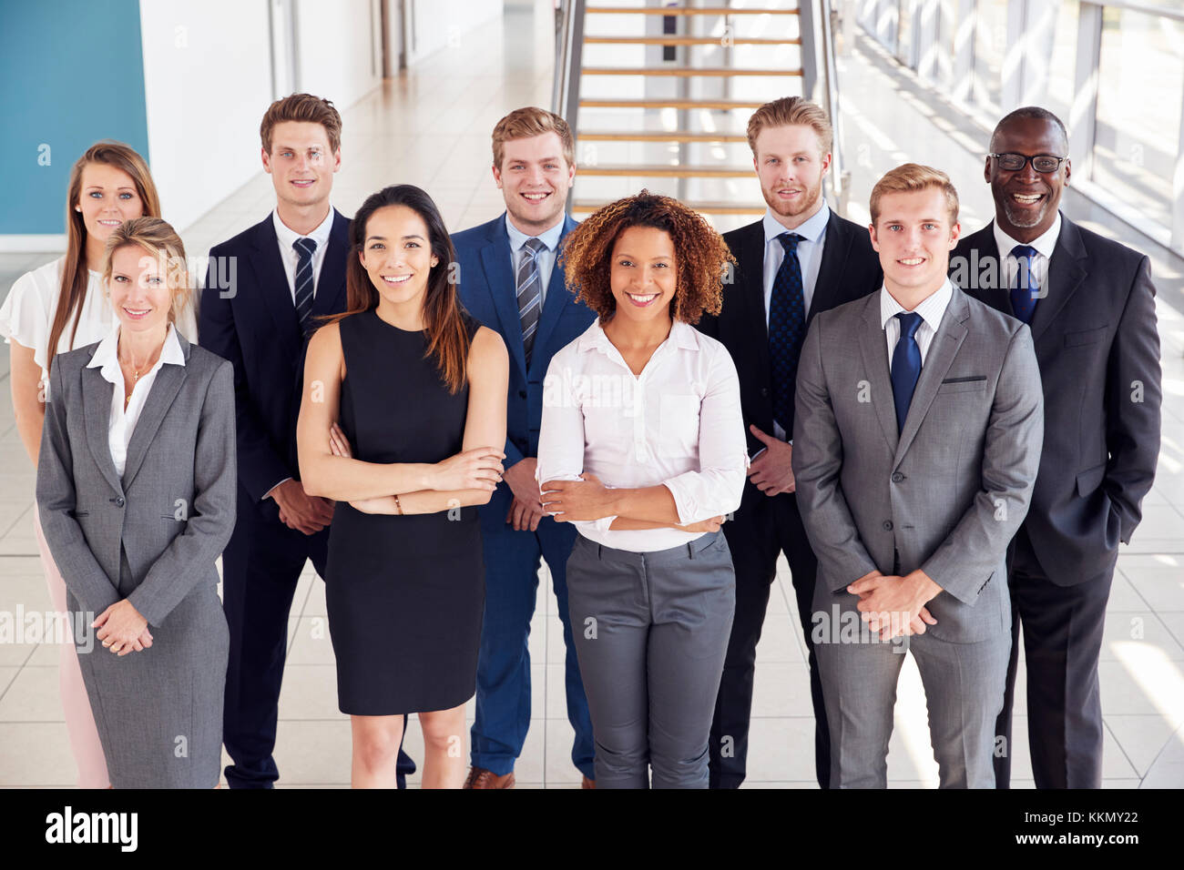 Office workers in a modern lobby, group portrait Stock Photo