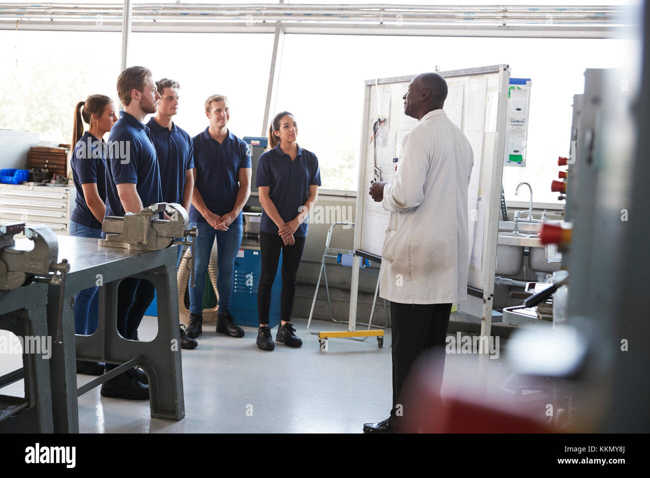 Engineering apprentices standing at a training presentation Stock Photo ...