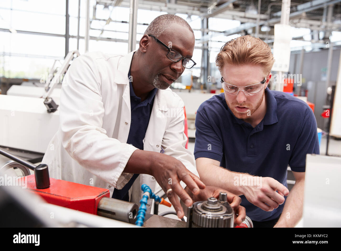 Engineer advising male apprentice hi-res stock photography and images ...