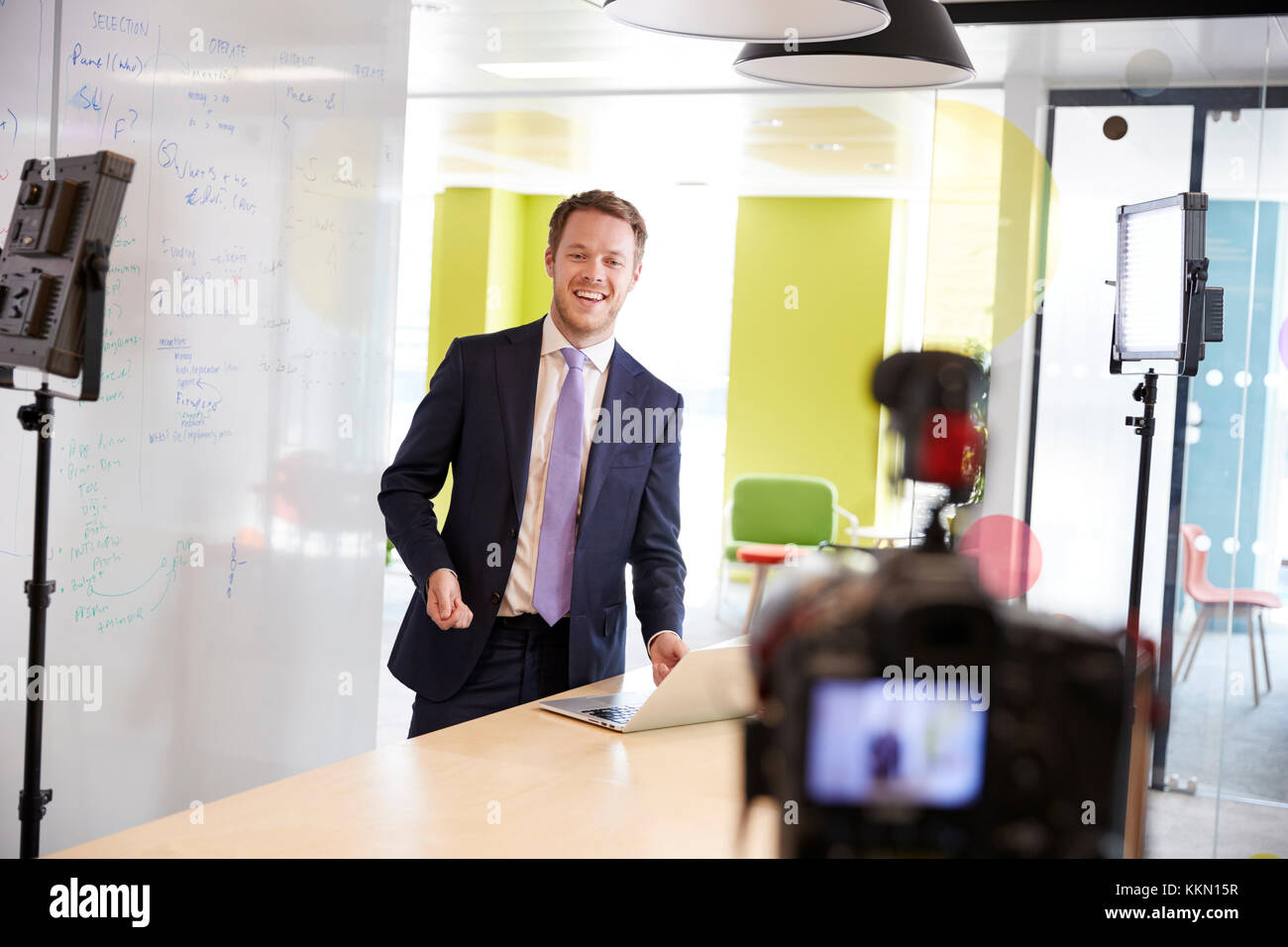 Young white man making a corporate demonstration video Stock Photo