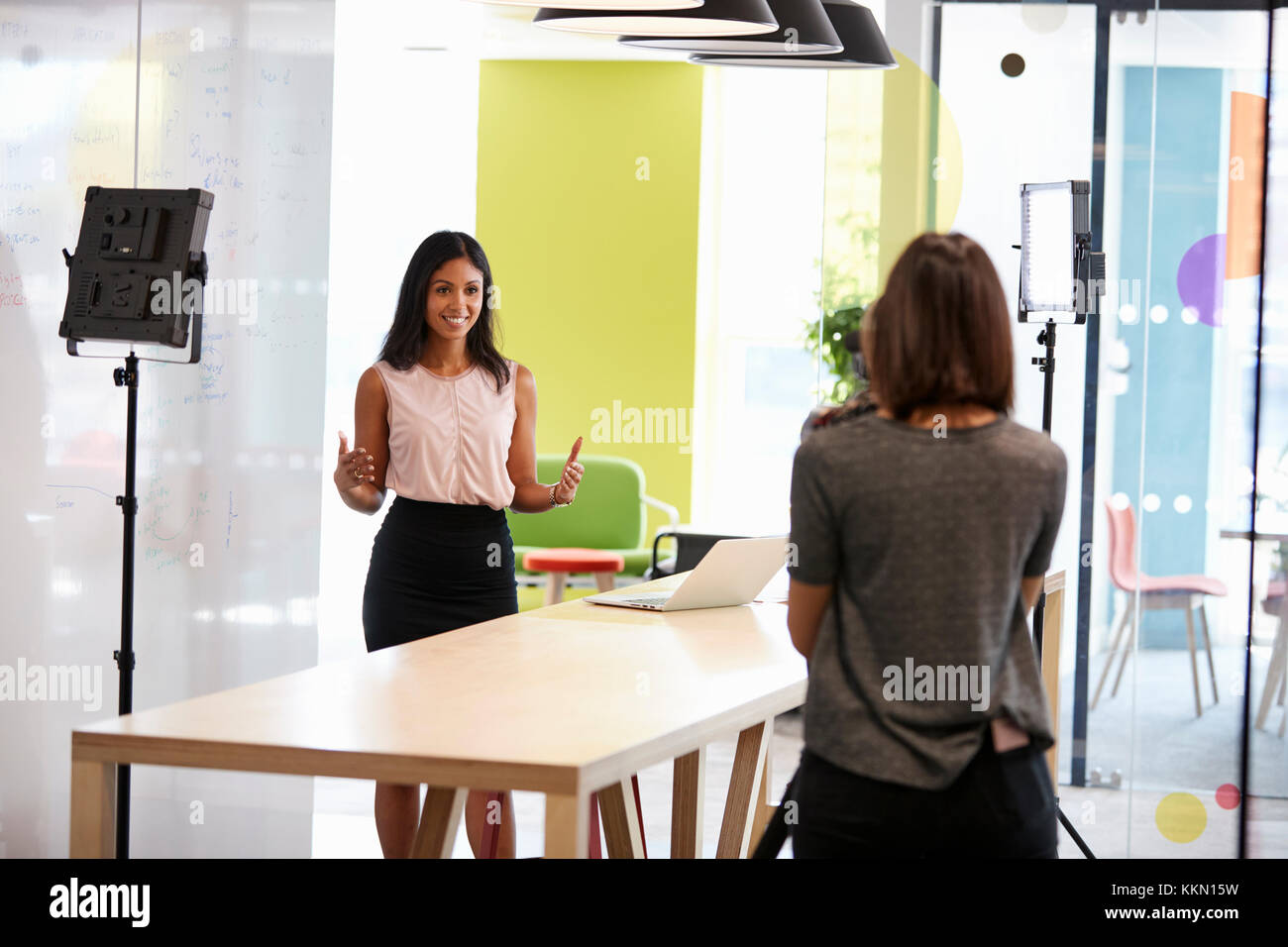 Two women making a corporate demonstration video Stock Photo