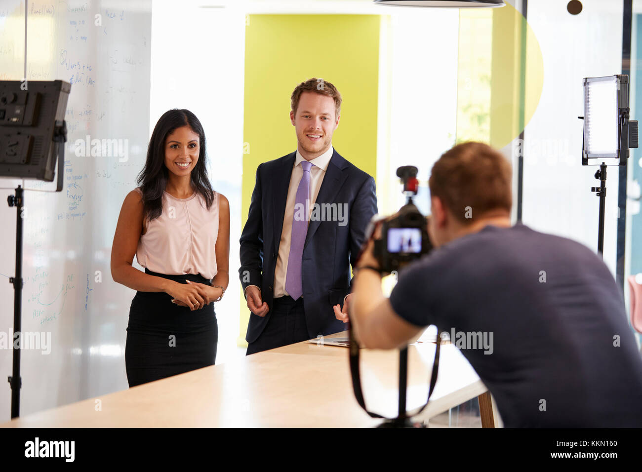 Three people making a corporate demonstration video Stock Photo