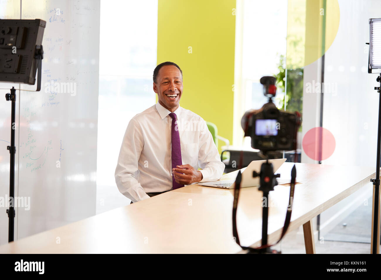Middle aged businessman making a corporate video Stock Photo