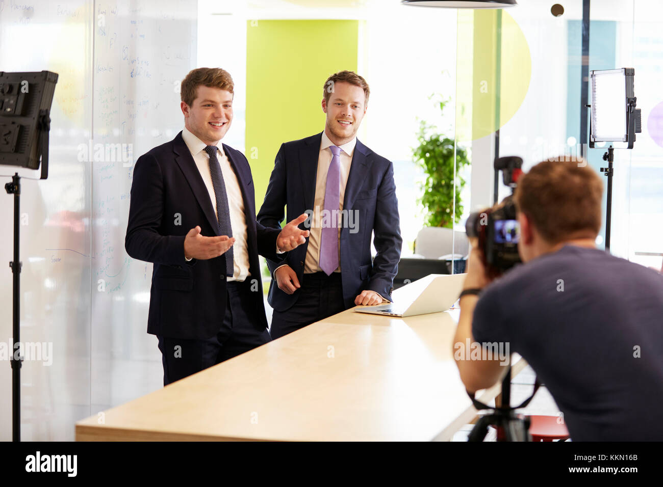 Cameraman and two businessmen making a corporate video Stock Photo