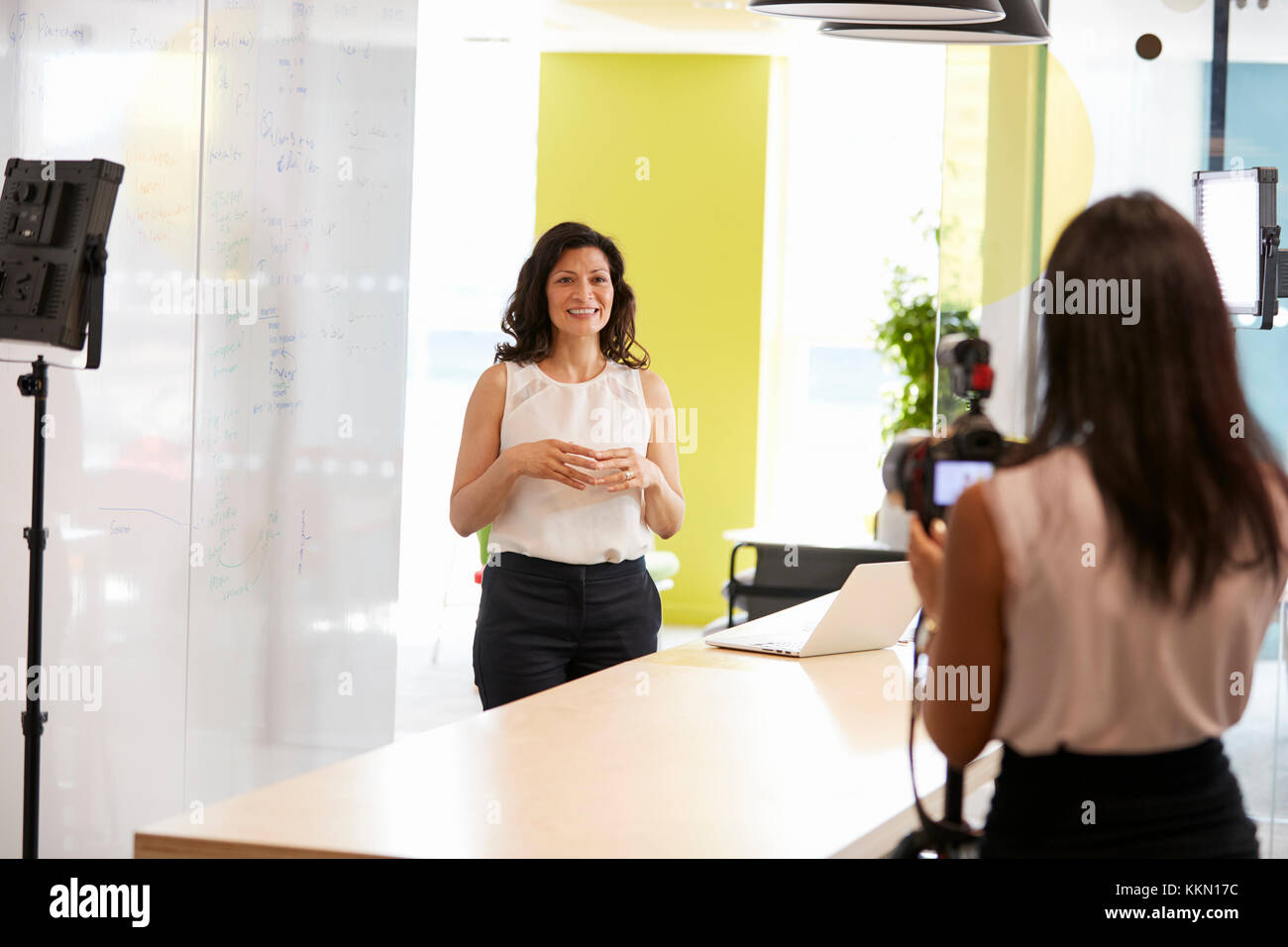 Two women filming a corporate demonstration video Stock Photo
