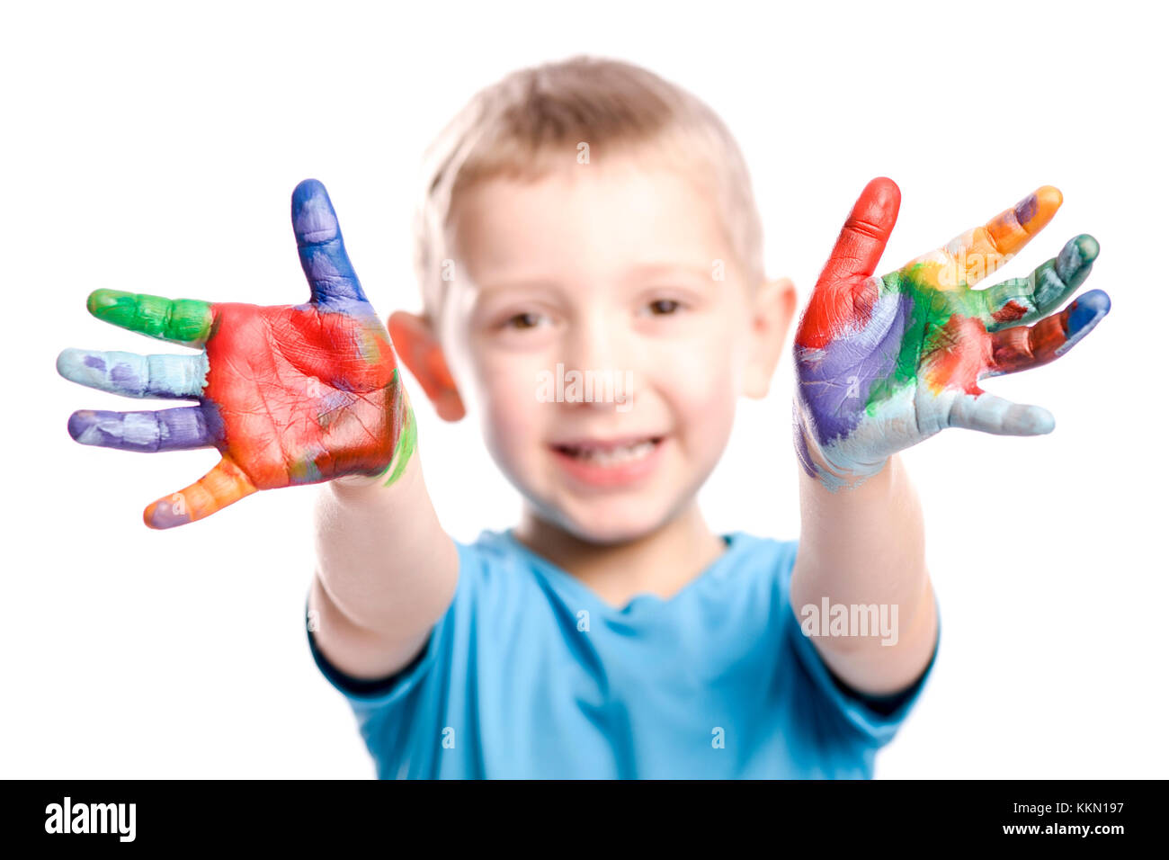 portrait of caucasian child with painted hands isolated on white background Stock Photo