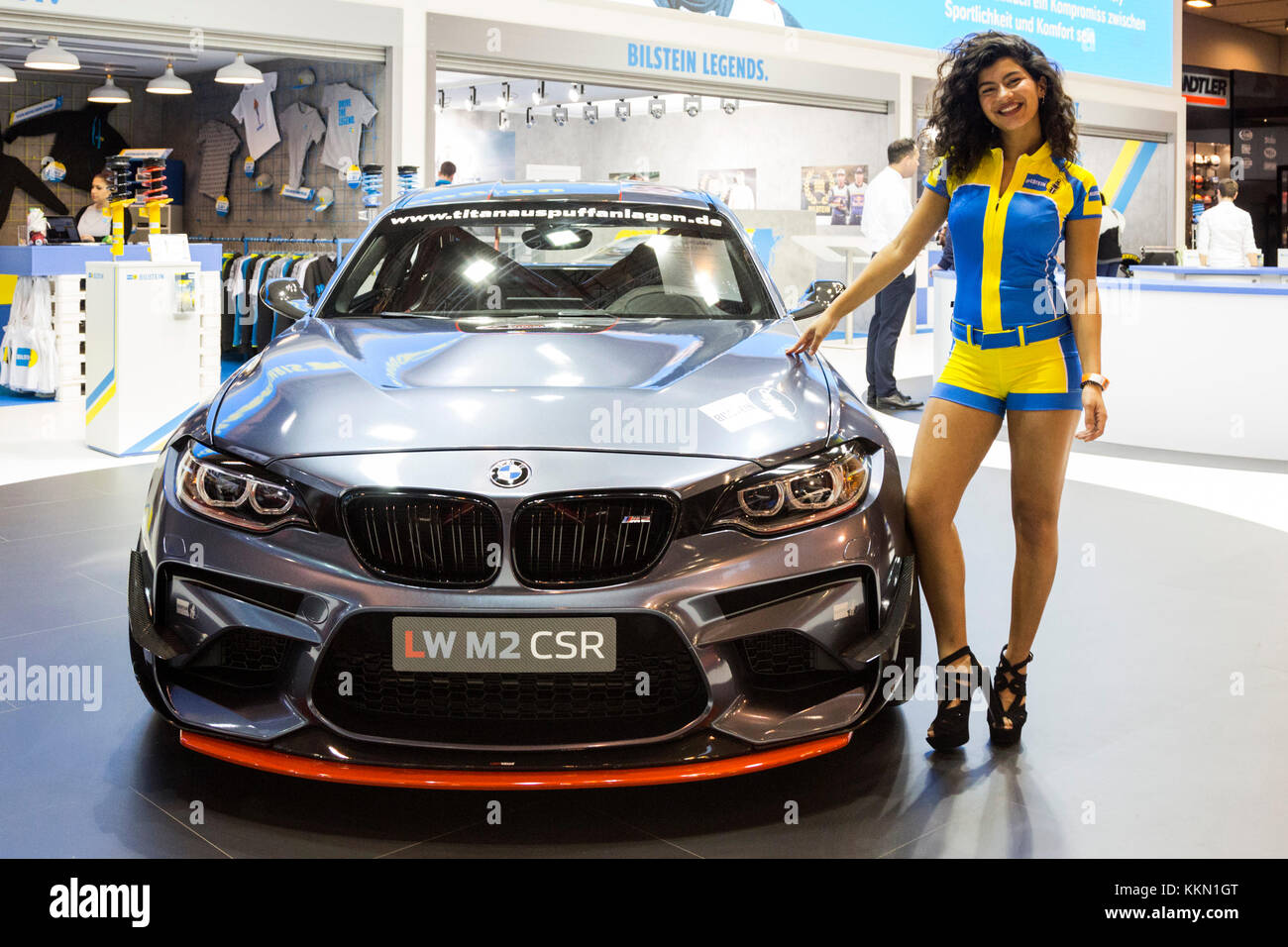 Essen, Germany. 1 December 2017. Female model posing with a BMW. The 2017  Essen Motor Show opens. More than 500 exhibitors are showcasing sporty  production vehicles, tunining, motorsport and classic cars. 2017