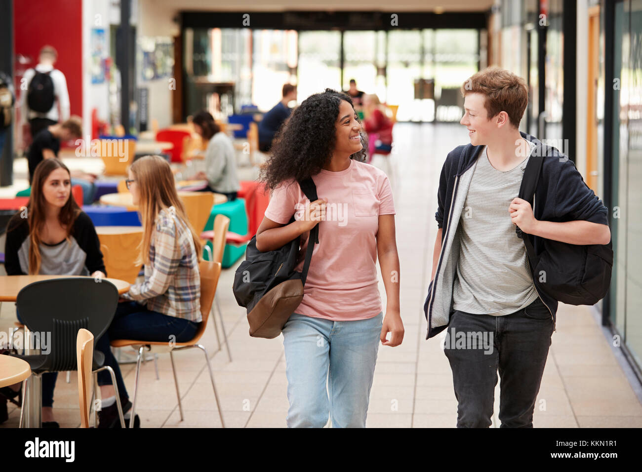 Communal Area Of Busy College Campus With Students Stock Photo
