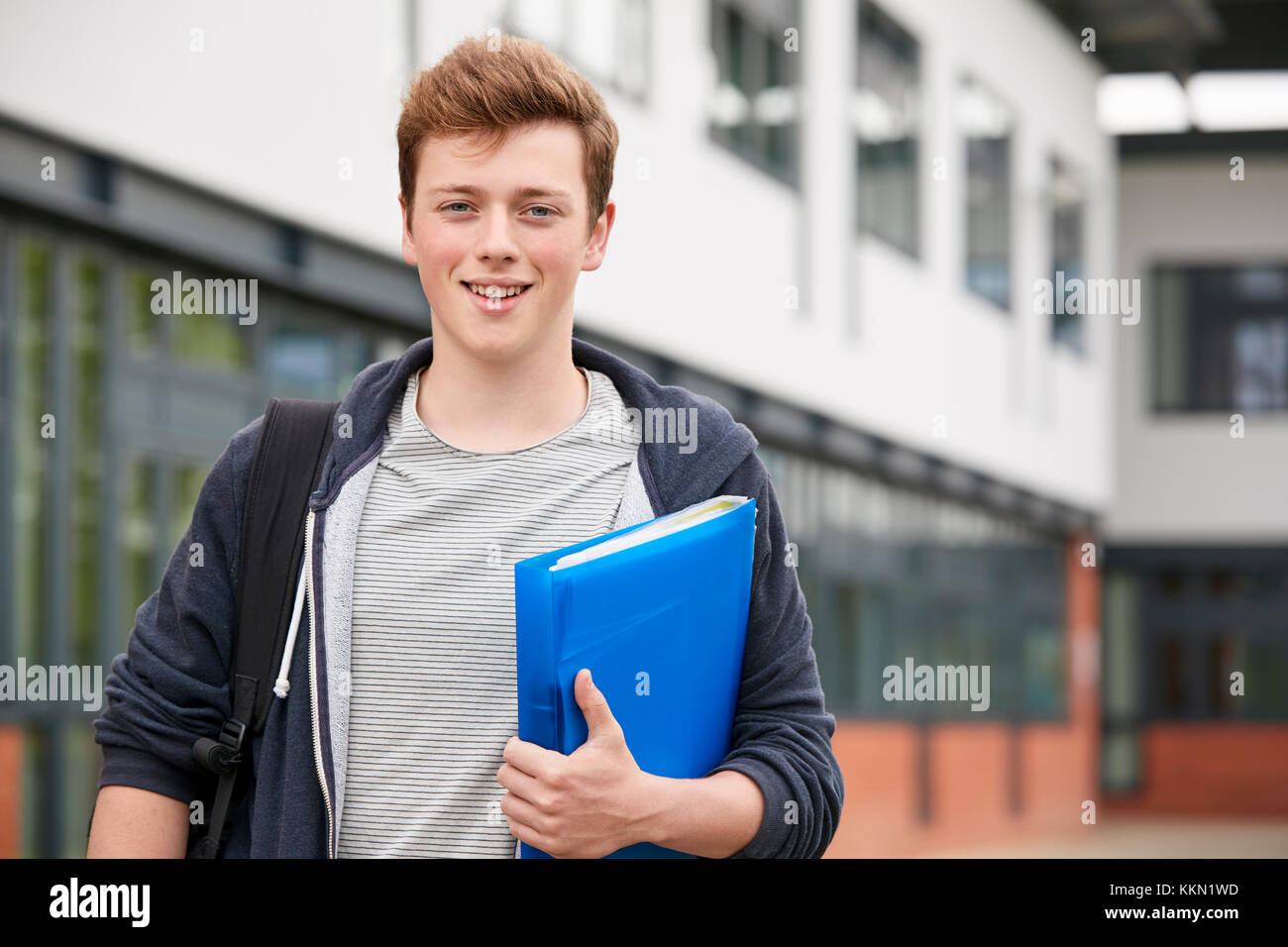 Portrait Of Male Student Standing Outside College Building Stock Photo