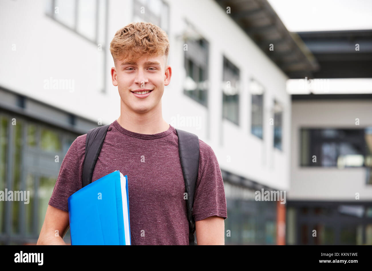 Portrait Of Male Student Standing Outside College Building Stock Photo