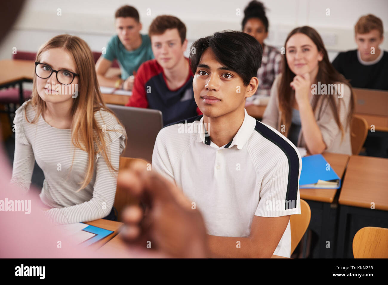 College Students In Class Viewed From Behind Teacher Stock Photo