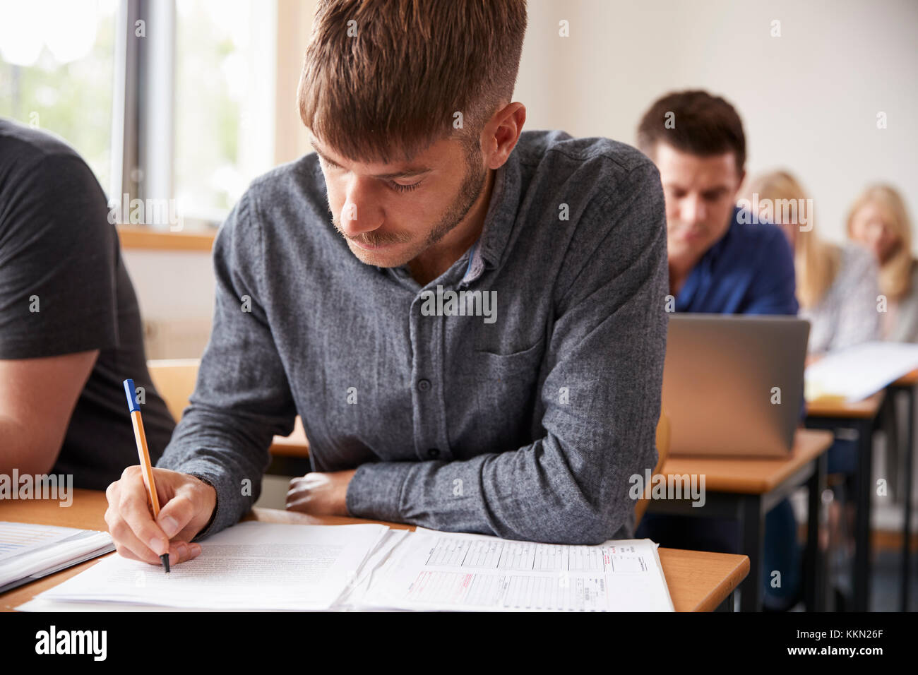 Mature Male Student Attending Adult Education Class Stock Photo