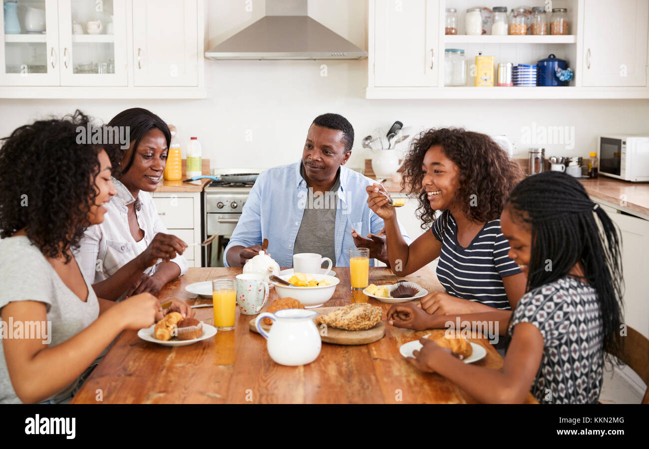 Family With Teenage Children Eating Breakfast In Kitchen Stock Photo - Alamy