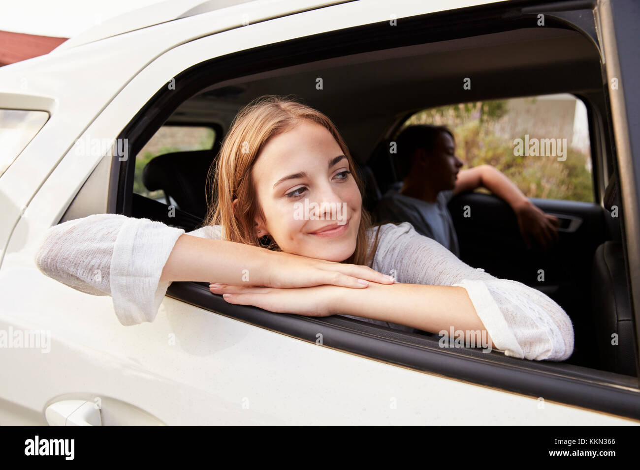 Family With Teenage Children In Car On Road Trip Stock Photo