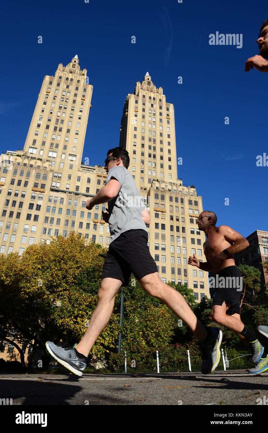 Joggers run around the Schuman Running Track in Central Park with The San  Remo building in the background Stock Photo - Alamy