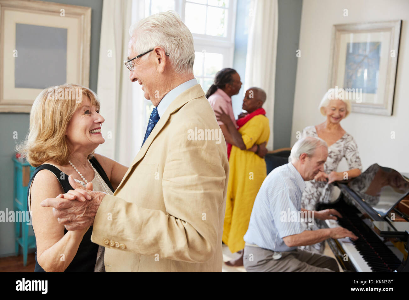 Group Of Seniors Enjoying Dancing Club Together Stock Photo