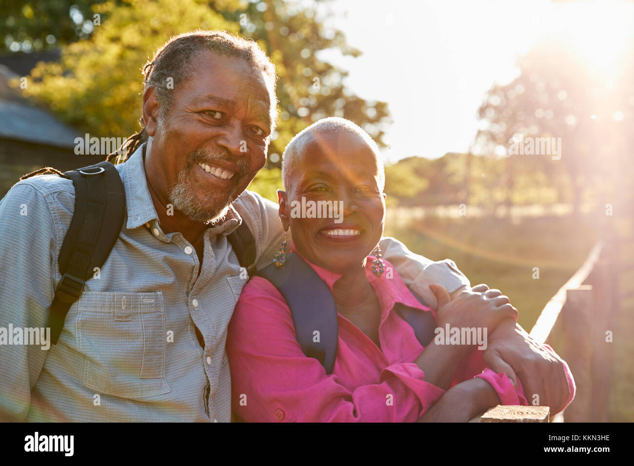 Portrait Of Senior Couple Hiking In Countryside Together Stock Photo