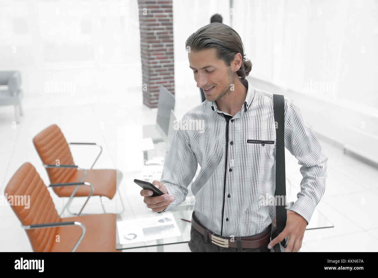 young employee standing in the office Stock Photo - Alamy