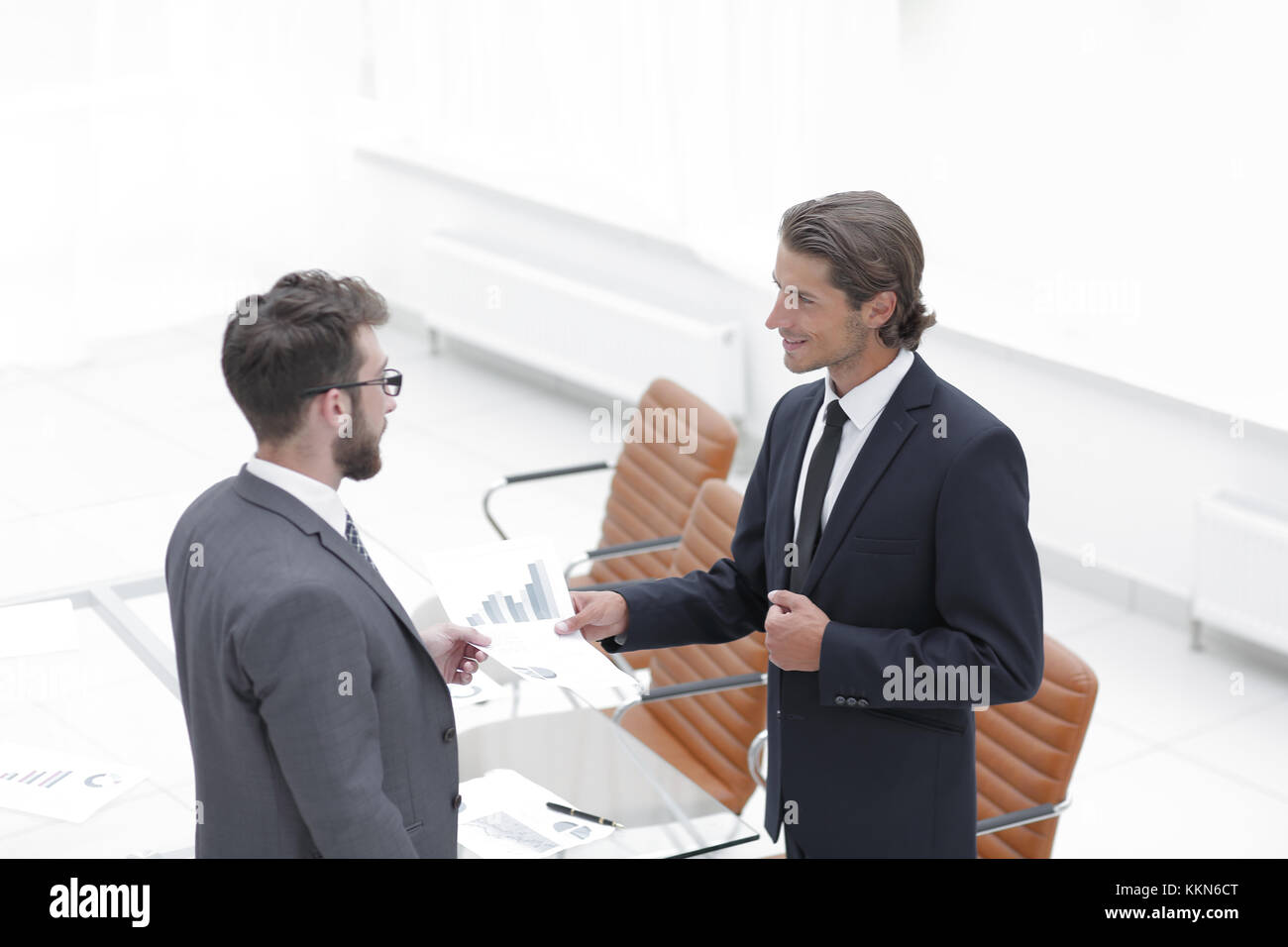 two businessmen talking in the office Stock Photo - Alamy