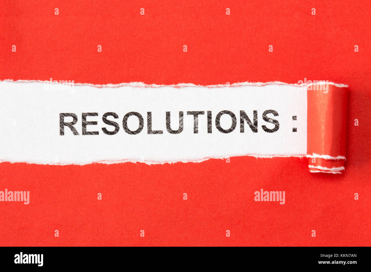 The phrase RESOLUTIONS appearing behind torn paper Stock Photo - Alamy