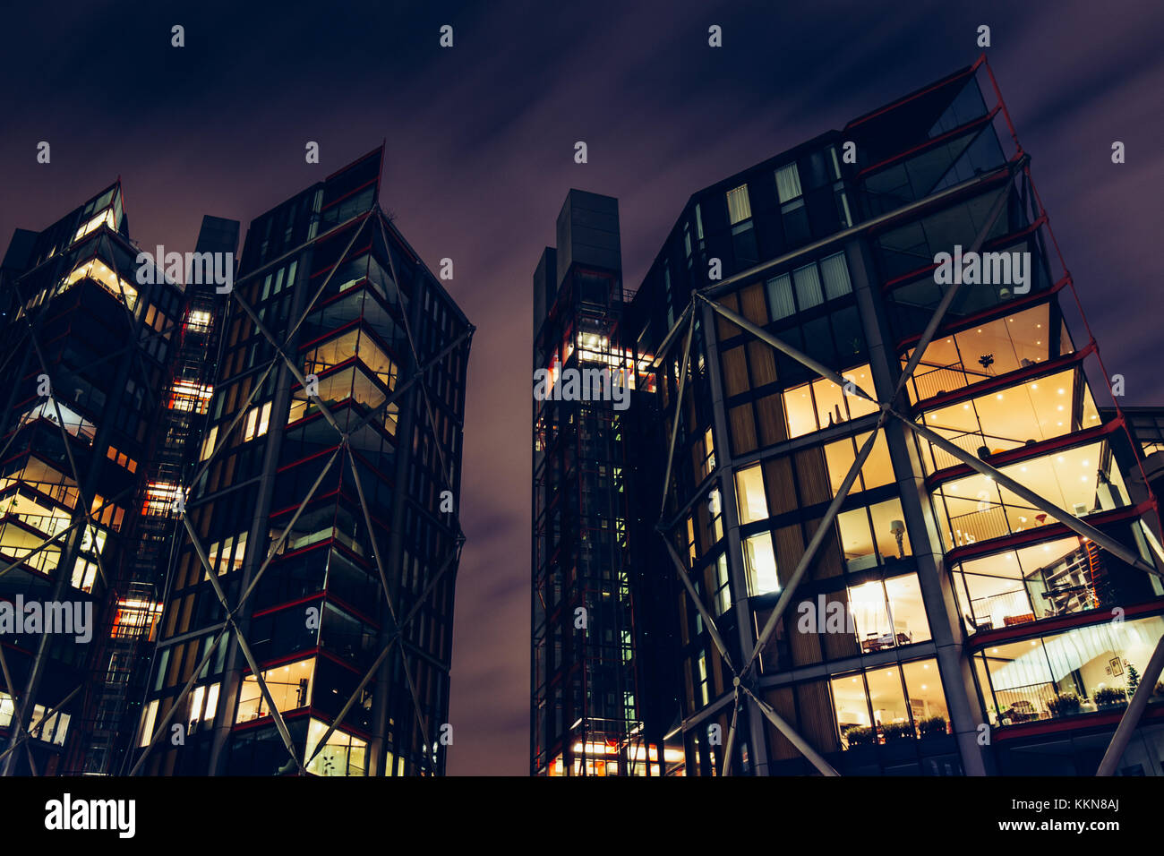 Low angle view of luxury modern apartment buildings on London cityscape skyline at night Stock Photo