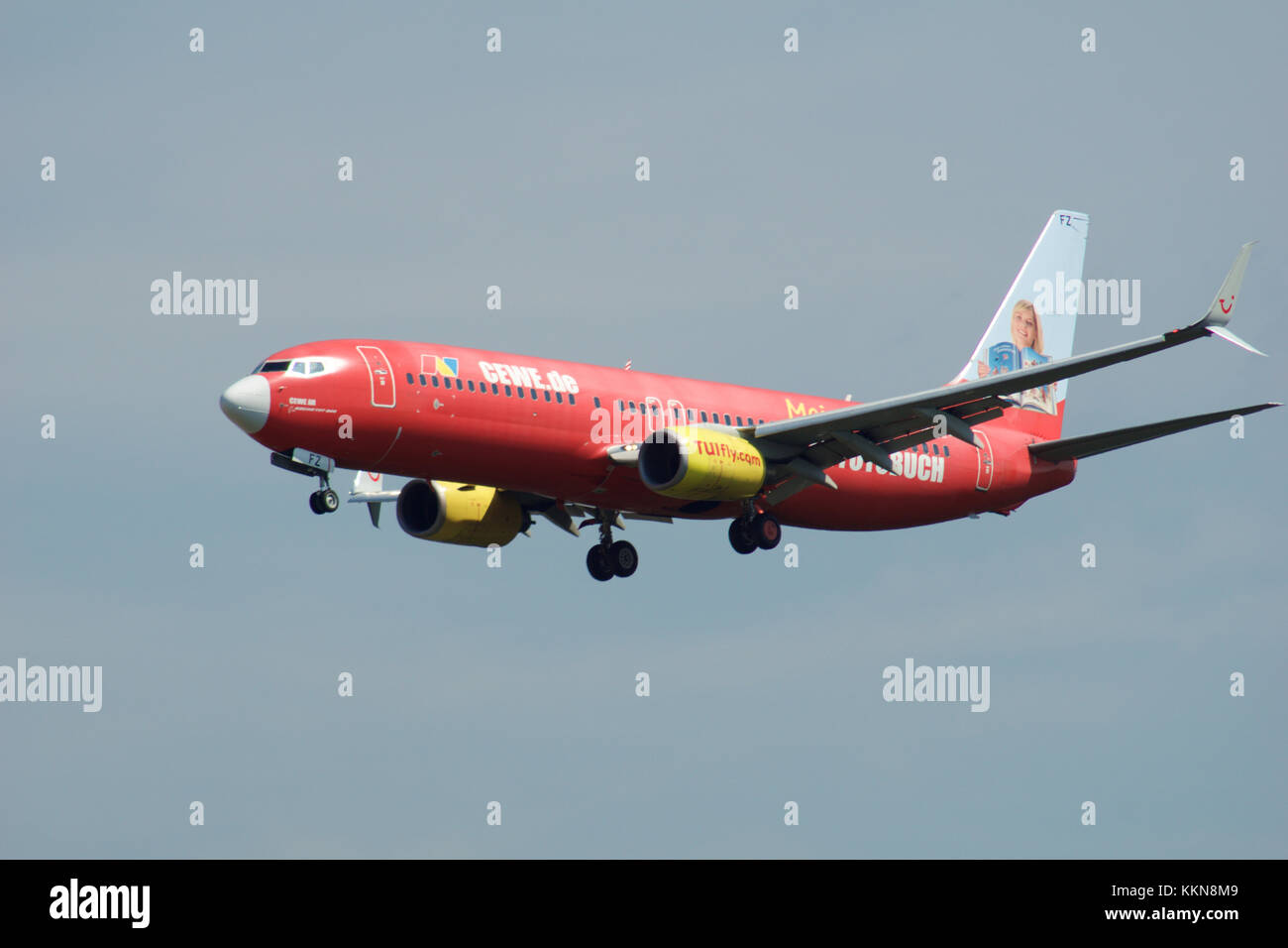FRANKFURT, GERMANY - JUL 09th, 2017: TUIfly AIRLINES Boeing 737-800 with red advertisement lands at Frankfurt airport, Boeing 737 Next Gen, MSN 30883, Registration D-AHFZ, TUIfly-a German leisure airline owned by the travel and tourism company TUI Group Stock Photo