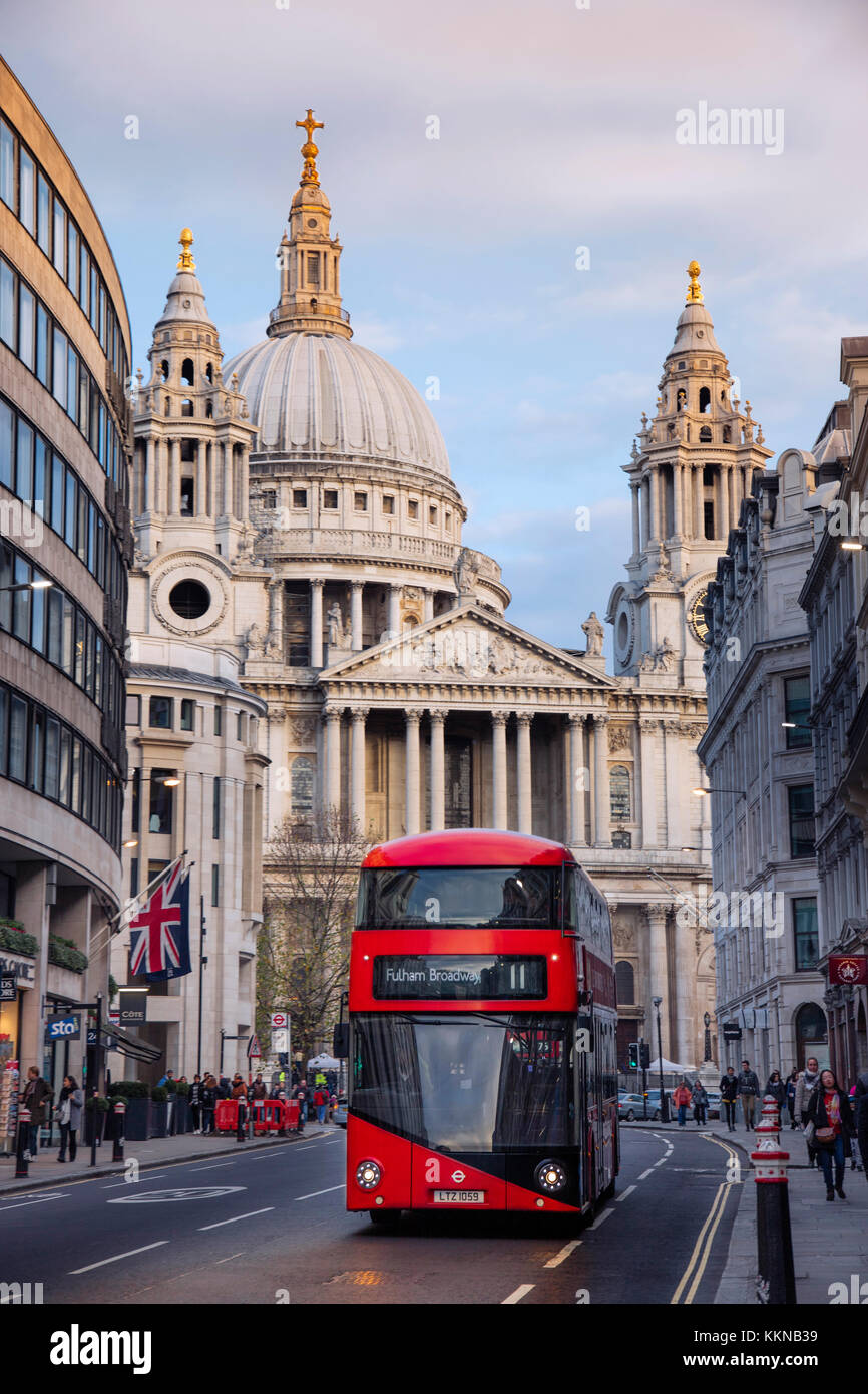 Red London double-decker bus in front of St Paul's Cathedral in the City of London financial district Stock Photo