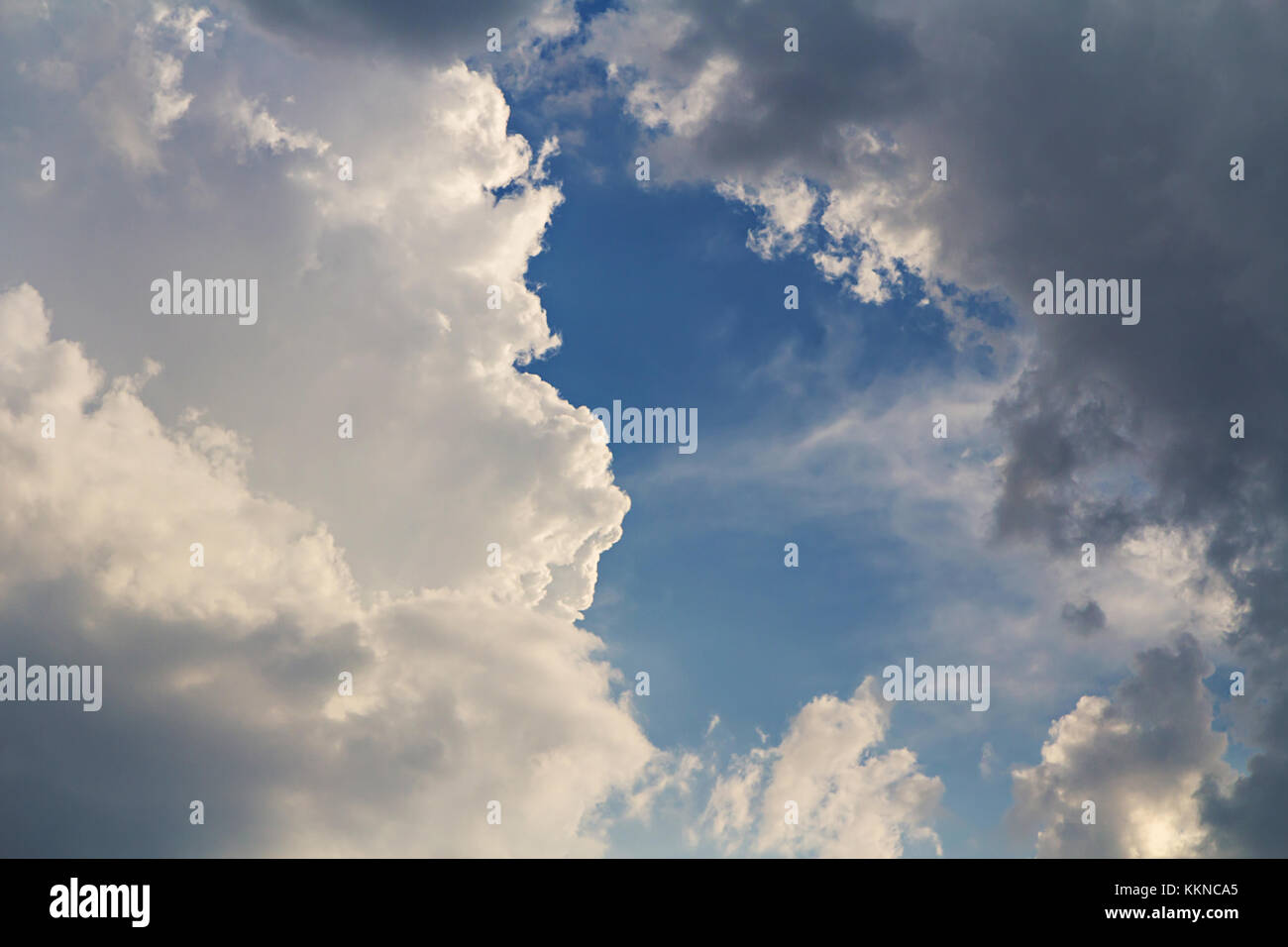 Dark clouds on blue sky background Stock Photo - Alamy