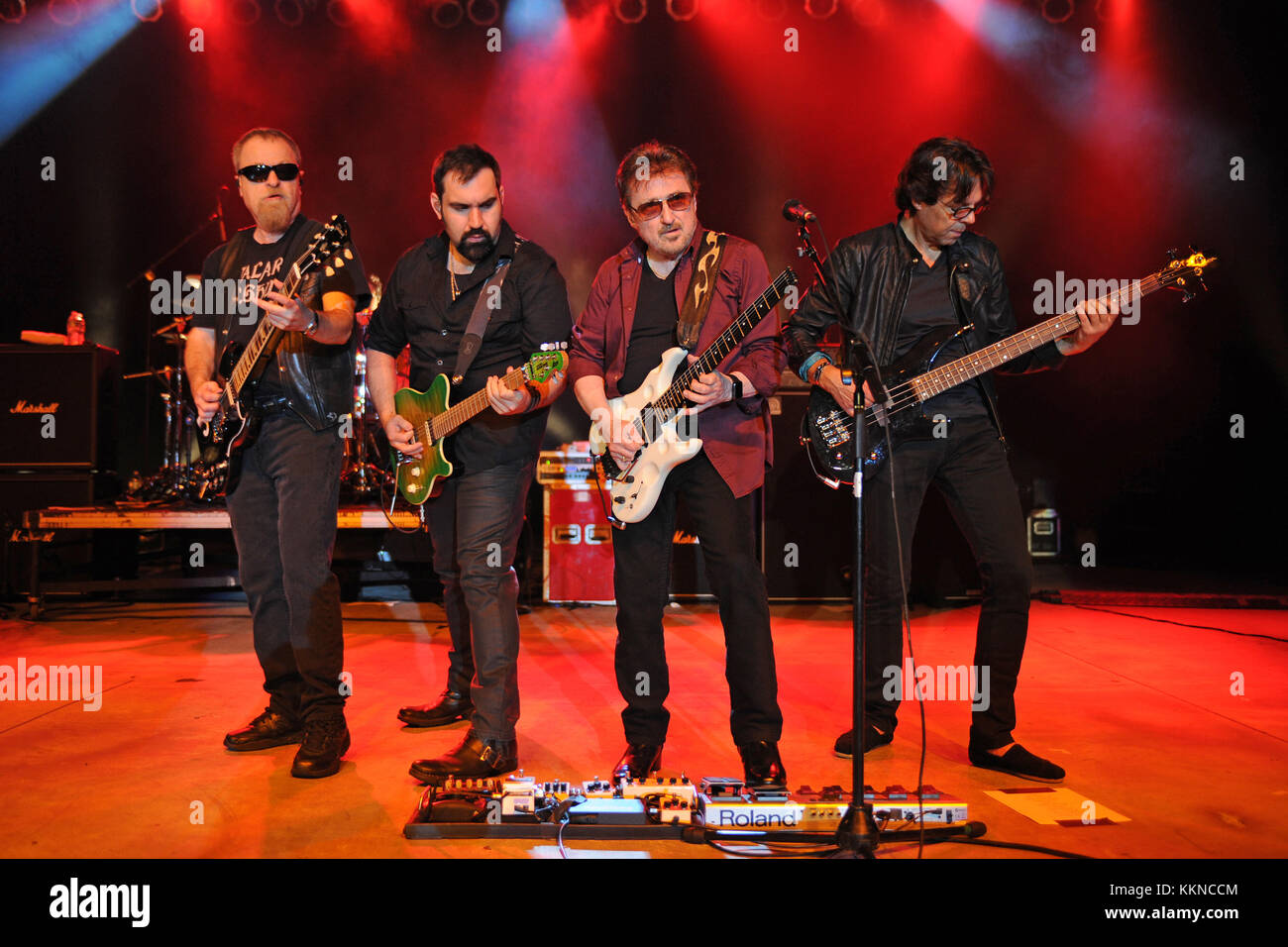 POMPANO BEACH, FL - AUGUST 15: Eric Bloom, Jules Radino and Donald 'Buck Dharma' Roeser of Blue Oyster Cult perform at the Pompano Beach Ampitheatre on August 15, 2015 in Pompano Beach Florida.   People:  Eric Bloom, Richie Castellano, Donald Roeser, Kasim Sulton Stock Photo