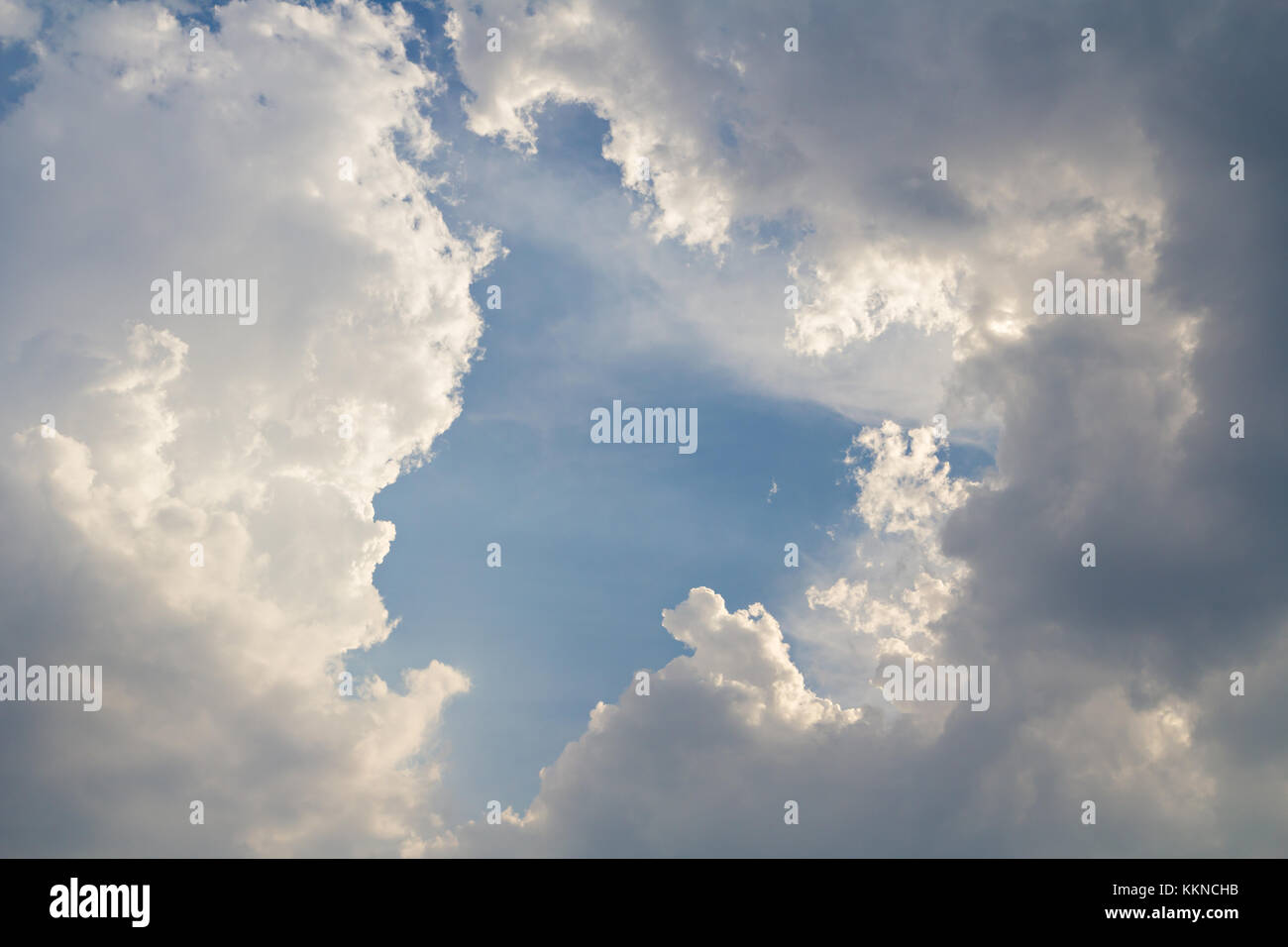 Dark clouds on blue sky background Stock Photo - Alamy