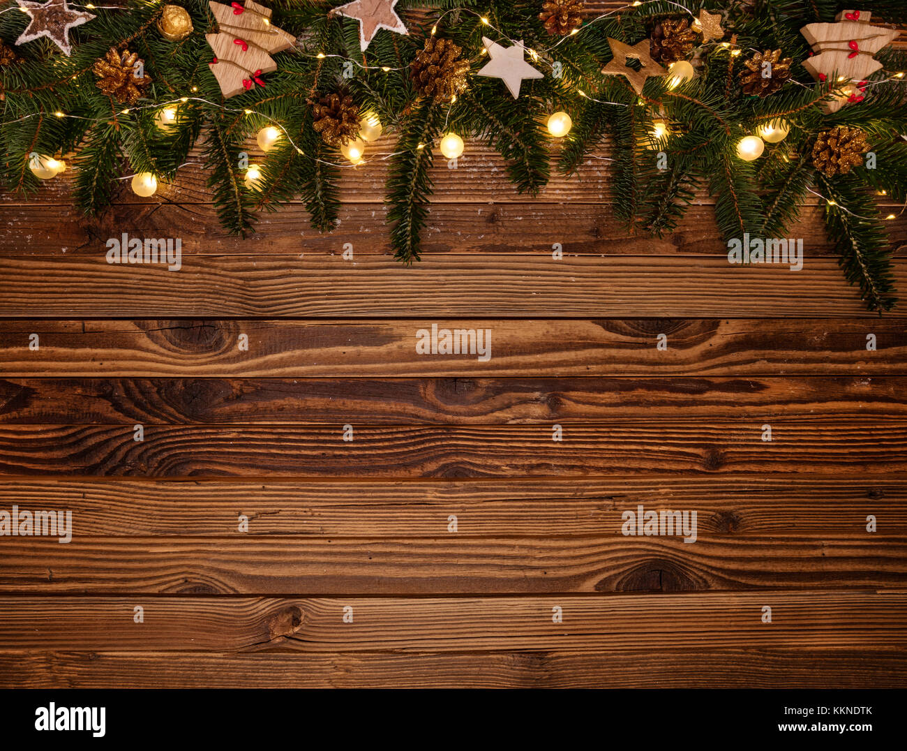 Christmas background with wooden decorations and spot lights. Free