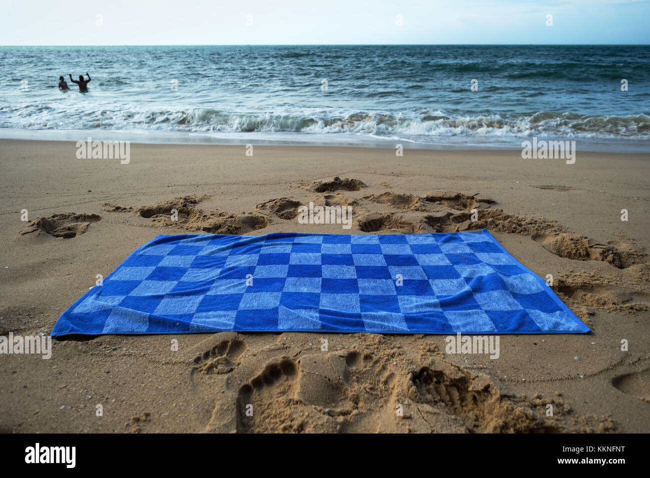 Blue towel on sandy beach Stock Photo Alamy