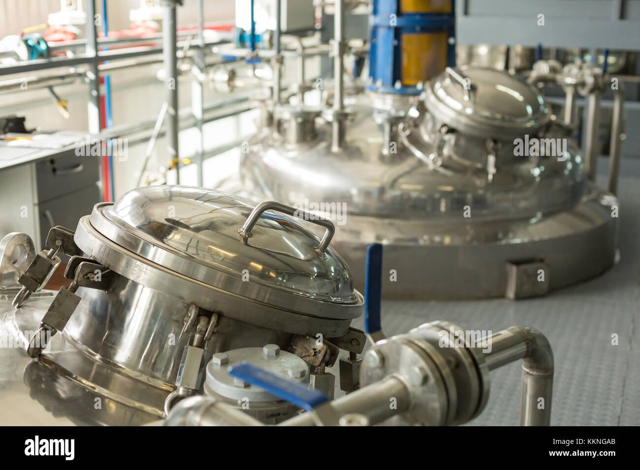 Tanks for chemical mixing on chemical plant. Concept: Manufacturing