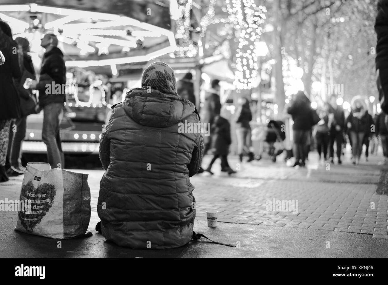 A female beggar begging in Christmas festival area monochrome, Luxembourg City Stock Photo