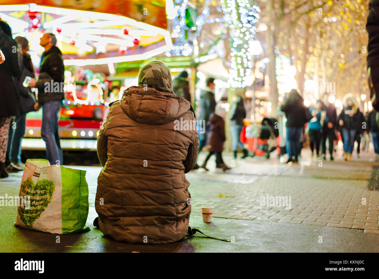 A female beggar begging in Christmas festival area, Luxembourg City Stock Photo