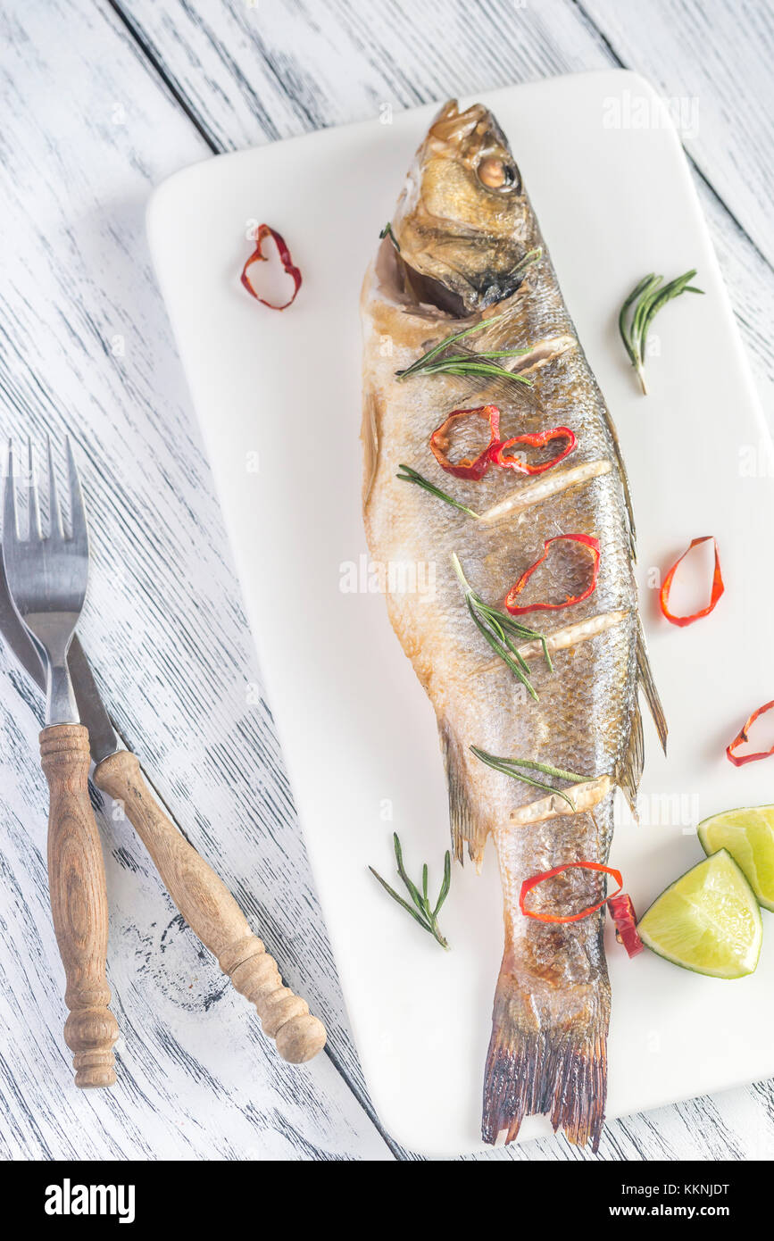 Baked sea bass with lime and chilli pepper Stock Photo Alamy