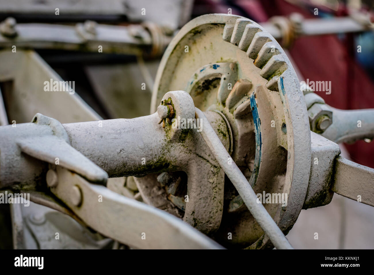 Old farm machinery on a farm. Root mechanisms and wheels in