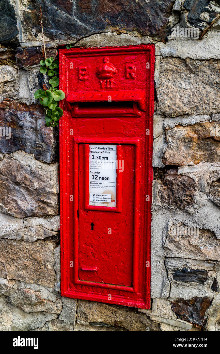 Red UK postbox built into a wall near Drakeford Bridge, Devon, UK Stock Photo